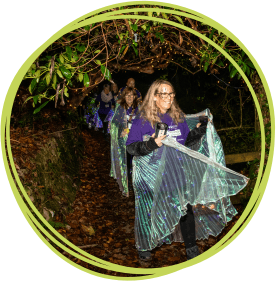 Participants in fancy dress walking through Heligan